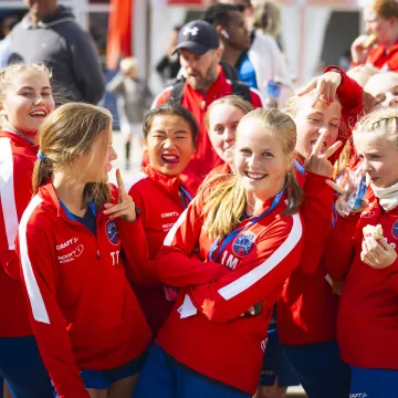 Happy football players celebrating after a match at Gothia Cup in Gothenburg – accommodation solution for teams during tournaments.